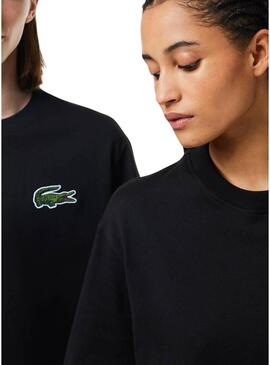 Maglietta Lacoste Unisex Loose Fit nera con logo coccodrillo.