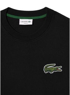 Maglietta Lacoste Unisex Loose Fit nera con logo coccodrillo.