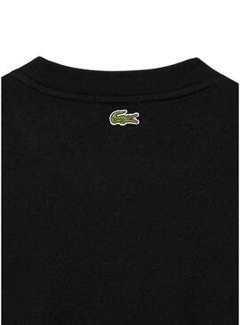 Maglietta Lacoste Unisex Loose Fit nera con logo coccodrillo.