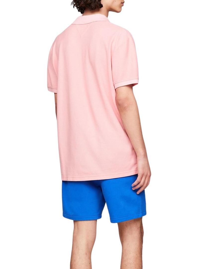 Polo Tommy Jeans Reg Badge Rosa per Uomo.