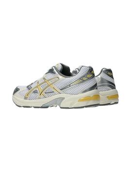 Scarpe Asics Gel 1130 gialle e argento per donna.