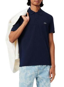 Polo Lacoste a coste blu scuro per uomo.