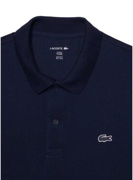 Polo Lacoste a coste blu scuro per uomo.