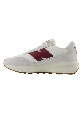 Sneakers New Balance U370 bianche e granate per donna e uomo.