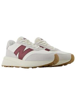 Sneakers New Balance U370 bianche e granate per donna e uomo.