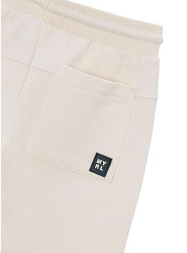 Pantaloni Mayoral bianchi tipo tuta per bambino.