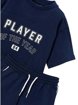 Set maglietta e bermuda blu scuro sportiva per bambino.